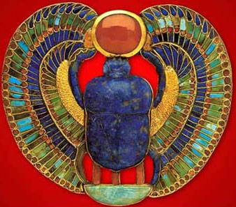 A very colorful winged scarab with a sun disk, made of gold, carnelian, turquoise, greed feldspar, lapis lazuli and calcite, from the tomb of King Tutankhamun