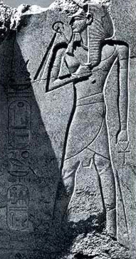 Ramesses II beneath the feat of the Colossus of Tuthmosis III