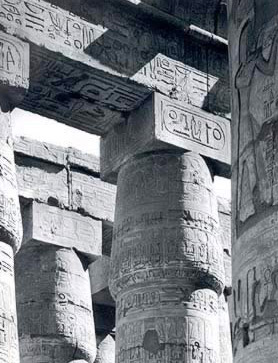 The first two north bays of the northwest group of monostyle columns. Note the cartouch of Ramesses II.